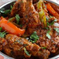 Chicken Kadai · Tender boneless chicken mixed with green peppers, and onions cooked together in a perfect co...