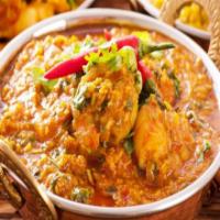 Chicken Madras · Boneless chicken cooked in onion and tomato gravy with the touch of chopped garlic mixed tog...