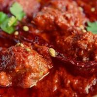 Lamb Madras · Boneless lamb cooked in onion and tomato gravy with the touch of chopped garlic mixed togeth...