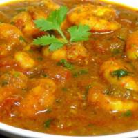 Shrimp Curry · Shrimp cooked in tomato and onion gravy sauce with the perfect combination of Himalayan herb...