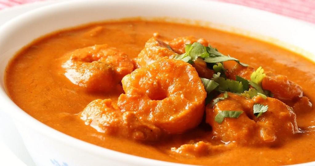Shrimp Tikka Masala · Shrimp cooked in creamy onion and tomato sauce with the perfect combination of Himalayan herbs and spices. Served with basmati rice or butter naan.