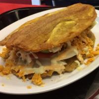Patacon (toston) Mixto Sandwich · Sandwich of green fried plantains (Toston) filled with grilled beef and grilled chicken (mix...