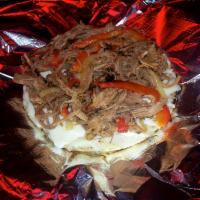 Mechas · Shredded beef served as topping on grilled Colombian arepa with mozzarella cheese.