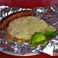 Chory · Sausage plus. Colombian sausage cooked on the grill and served with an arepa with mozzarella...