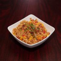 Bacon Kimchi Fried Rice · Savory bell peppers, corn, onion and kimchi with seasoned fried rice. Topped with bits of ba...