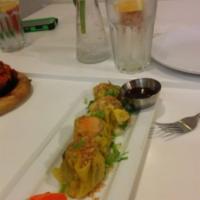 Dim Sum · Steamed pork and shrimp dumpling served with soy sauce chili vinaigrette dips.