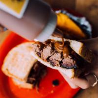 Beef Brisket Sandwich · Served on Texas toast (bun or garlic toast upon request).
