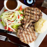 Grilled Pork Chops  Lunch  · 12 oz 2 pieces pork chops Served with salad, mash and gravy.