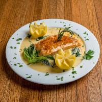 Salmon Crostino · Baked panko crusted salmon served over baby spinach, light creamy dill sauce.