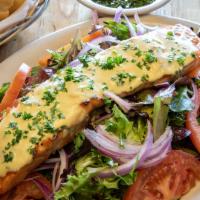 Ensalada con Salmon · Grilled fresh filet of salmon brushed with homemade Dijon sauce on a bed of baby mixed green...
