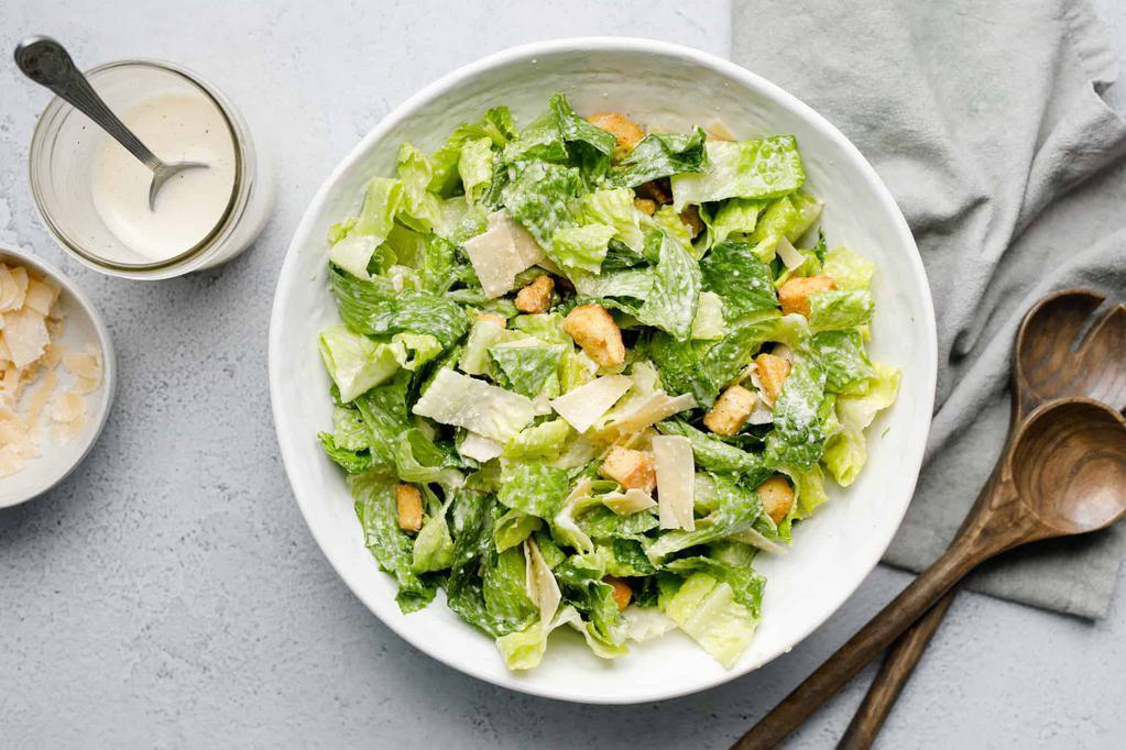 Insalata di Cesare · Romaine, homemade croutons, shaved Parmesan and Caesar dressing.