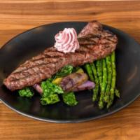 10 oz. New York Strip · Fingerlings with black kale, grilled asparagus, and red wine compound butter.