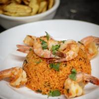 Arroz con Camarones · Mixed seasoned yellow rice mixed with shrimp. Served with salad with choice of dressing.
