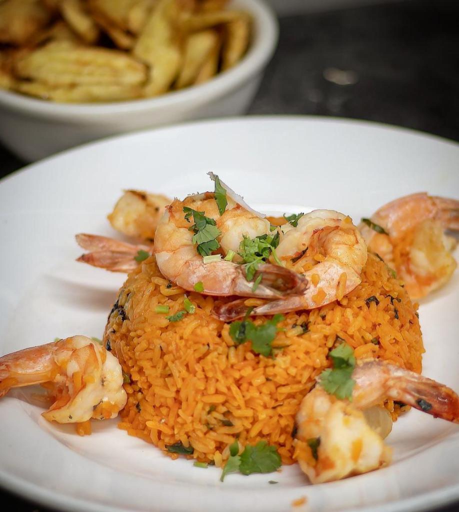 Arroz con Camarones · Mixed seasoned yellow rice mixed with shrimp. Served with salad with choice of dressing.