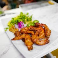 Lemon Garlic Wings · Lemon Garlic Marinated Wings served with ginger, red onion, jalepeno, cilantro, cashew nuts ...