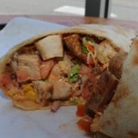 Tropical Chicken Roti Combo · Well seasoned boneless chicken breast and thighs, with little to no heat, slow cooked over a...