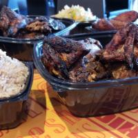 2 Whole Chickens with 4 Large Sides · Choose from 2 Jerk or tropical whole chickens to feed the family. Includes 4 large sides. Co...