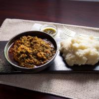 Egusi Soup · Nigerian soup thickened with ground seeds and spinach with assorted meat.