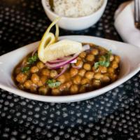 Channa Masala · Garbanzo bean cooked with onions, tomatoes and garam masala. Spicy.