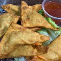 4. Fried Wonton  · 7 pieces. Deep fried wonton wrap with wound chicken & vegetables served sweet and sour sauce.