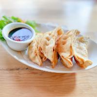 11. Pot Sticker · 7 pieces. Fried pork potstickers. Served with sweet and sour sauce 