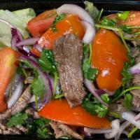 27. Spicy Beef Salad · Grilled slices of beef, lettuce, tomatoes, onions and cilantro in spicy lime juice.