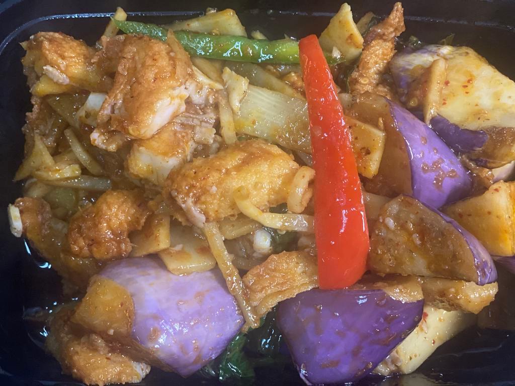 37. Pla Dook Pad Ped · Fried catfish with chili sauce, eggplants, bamboo shoots, bell peppers, onions and sweet basil leaves. Spicy.