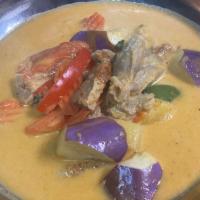 43. Duck Curry · Roasted duck in red curry and eggplants, tomatoes, pineapple, bell pepper and sweet basil. S...