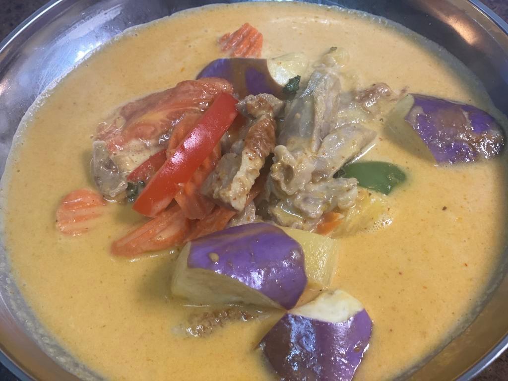 43. Duck Curry · Roasted duck in red curry and eggplants, tomatoes, pineapple, bell pepper and sweet basil. Spicy.