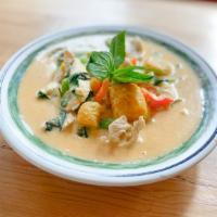 77. Thai Pumpkin Curry · Thai red curry sauce, bell peppers and basil. Spicy.