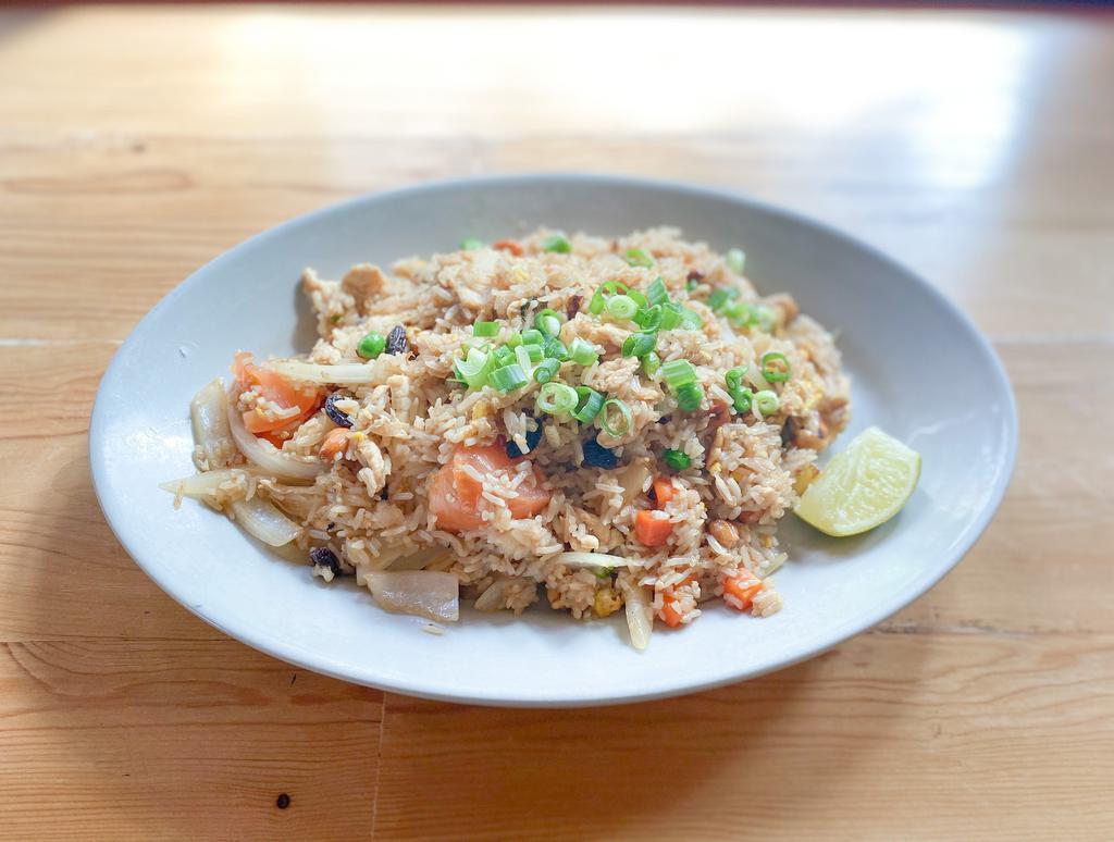 97. Pineapple Fried Rice · Fried rice with egg, chunks of pineapple, onions, cashew nuts and mixed vegetables.