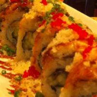 Spicy Nemo Roll · Spicy yellowtail and salmon topped with eel, avocado, tempura flakes, roe, scallion and spic...