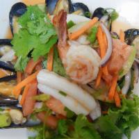 14. Yum Talay · Paradise of fresh shrimp, scallops, mussels and squid cooked on low heat to perfection with ...
