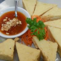 55. Golden Triangle · Top choice and deep-fried tofu served with sweet chili sauce. Vegetarian.
