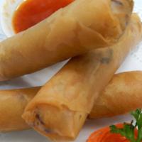 56. Por Pea Jae Spring Rolls · Crispy vegetable rolls stuffed with cellophane noodles, cabbage, carrots and mushrooms serve...