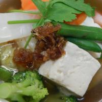 19. Tofu Soup · A delicate mix of fresh vegetables. Cabbage, carrot, broccoli and more in a clear broth.