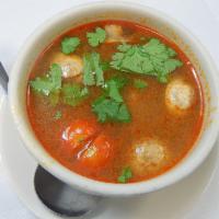 21. Tom Yum Soup · Choice of item with mushrooms and tomatoes in Thai spicy lemon grass broth. Medium spice.