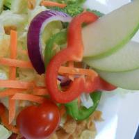 15. House Green Salad · Lettuce, cucumbers, tomatoes, onions, green pepper, carrots and apple topped with crispy won...