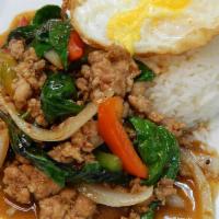 Dinner Krapow Gai Khai Daao · Sauteed ground chicken with fresh basil leaves, red peppers, green peppers, and onions in a ...