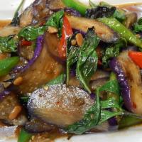 61. Spicy Eggplant · Grilled eggplant sauteed with red peppers, green peppers and basil leaves in spicy chili and...