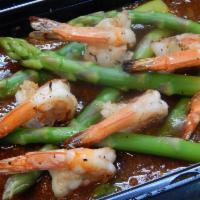 47. Shrimp Siam · Grilled shrimp served on top of asparagus with roasted chili pepper sauce. Served with steam...