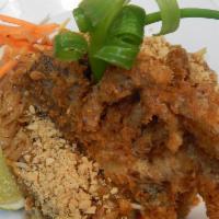52. Soft Shell Crab · 1 deep-fried soft shell crab served with your choice of yellow curry sauce (onions, green an...