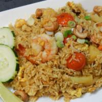Pineapple Fried Rice · Shrimp, chicken, egg, garlic, curry powder, raisins, onion, tomatoes, and carrot.