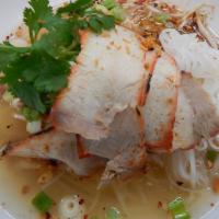 Tom yum noodle soup · Rice noodles, roasted pork, ground chicken, crispy pork skin, bean sprouts, scallions cilant...