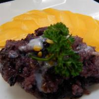 Mango & Black sticky rice · Black sticky rice tossed with sweetened coconut milk served with fresh-cut mango.  