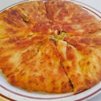 Aloo Paratha · Bread stuffed with potatoes, onions and spices and baked in a clay oven.