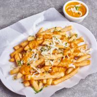 Garlic Tikka Fries · Potato fries tossed with minced garlic Parmesan cheese and onions with a tikka sauce drizzle...