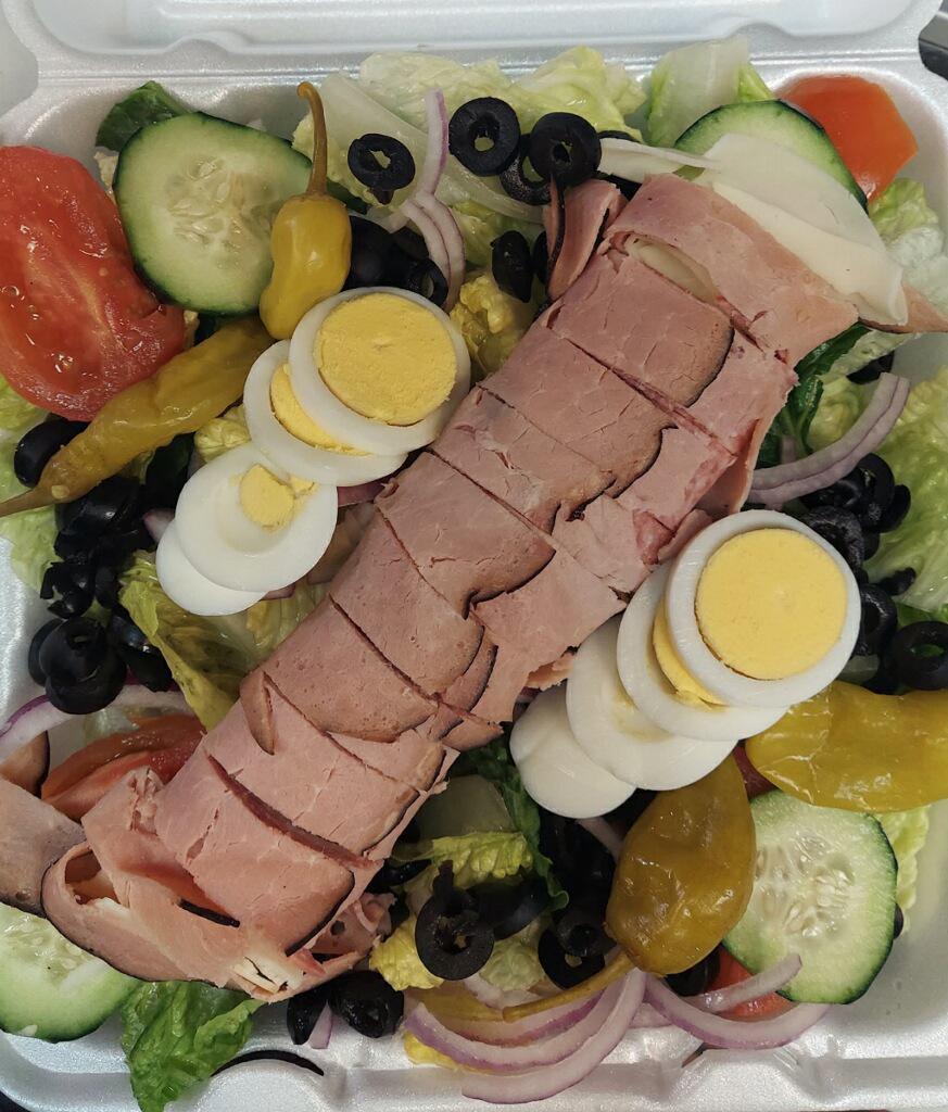 Antipasto Salad · Romaine lettuce, tomatoes, cucumbers, onions, olives, provolone cheese, pepperoncini, salami and a hard-boiled egg. Italian Dressing