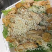 Grilled Chicken Caesar Salad · Marinated grilled chicken on top of romaine lettuce, croutons and Parmesan cheese with Caesa...
