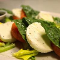 Caprese Salad · Buffalo mozzarella and fresh tomatoes.